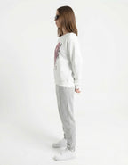 Rear view of a white crewneck sweatshirt for women, highlighting the clean fit and high-quality fabric finish.