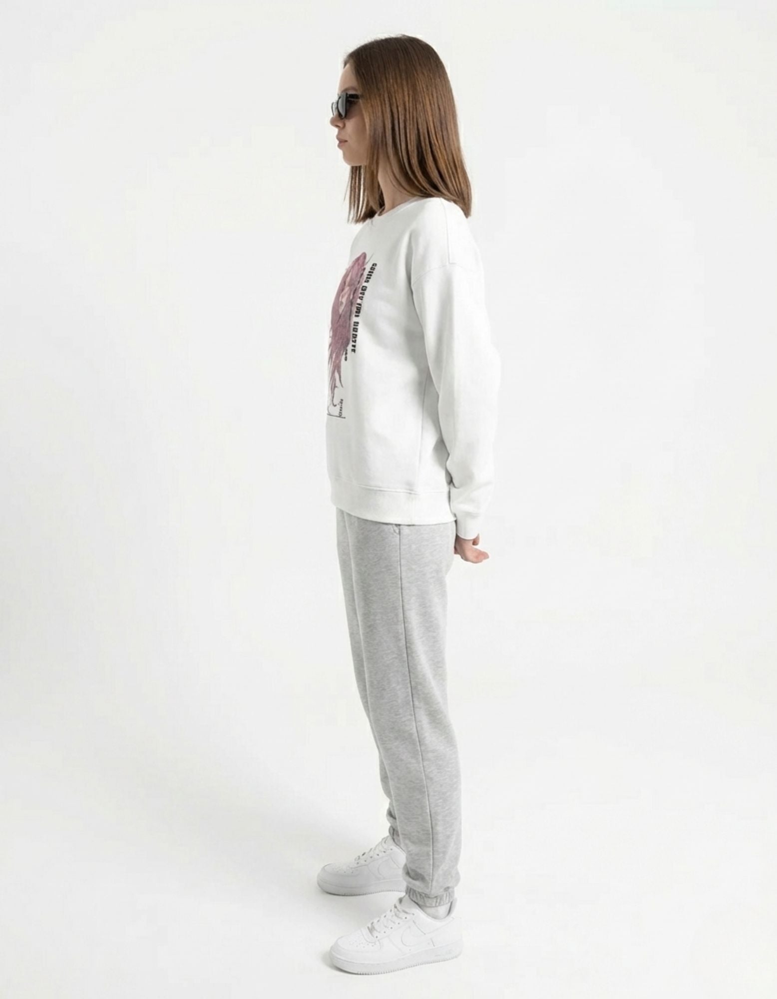 Rear view of a white crewneck sweatshirt for women, highlighting the clean fit and high-quality fabric finish.
