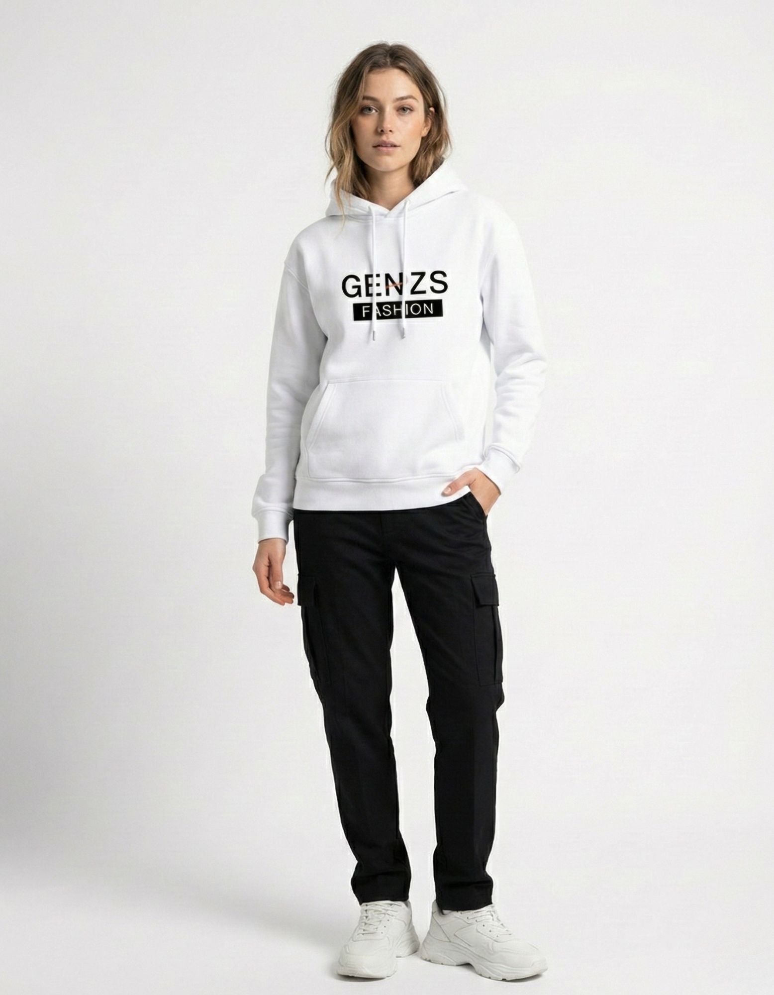 Female model showcasing the GENZs Fashion white unisex logo hoodie, styled with black cargo pants for a trendy, minimalist aesthetic.