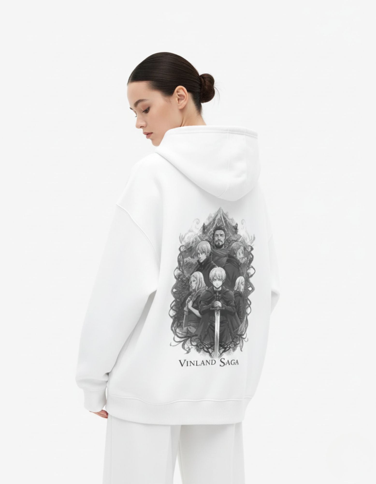 Female model showcasing the back design of a white Vinland Saga streetwear hoodie, featuring premium manga-style character art.